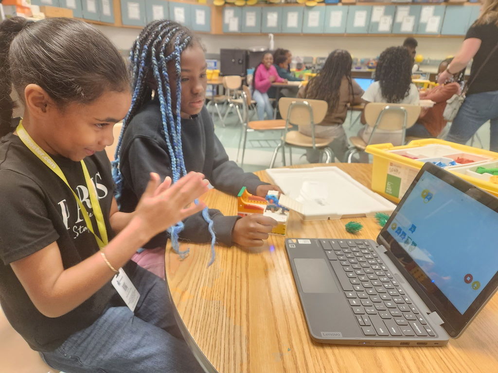 students building with legos