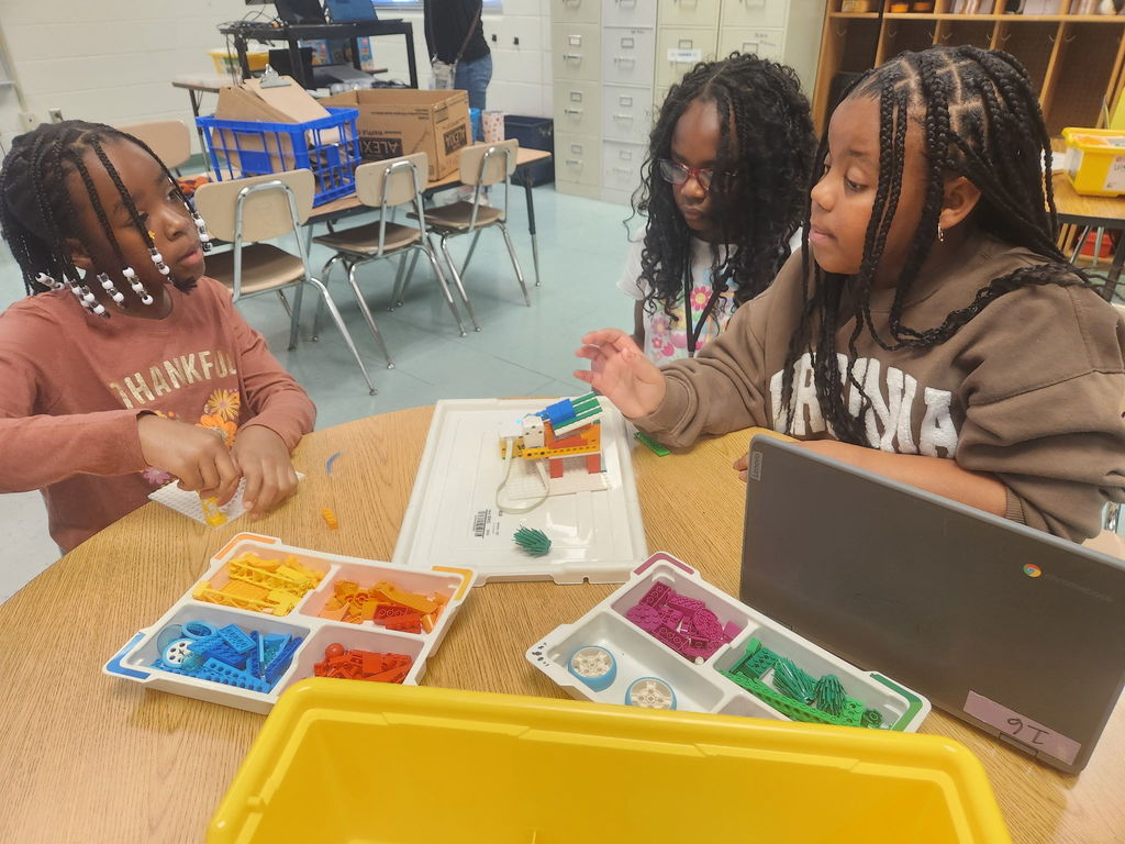 students building with legos