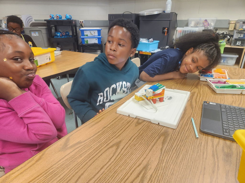 students building with legos