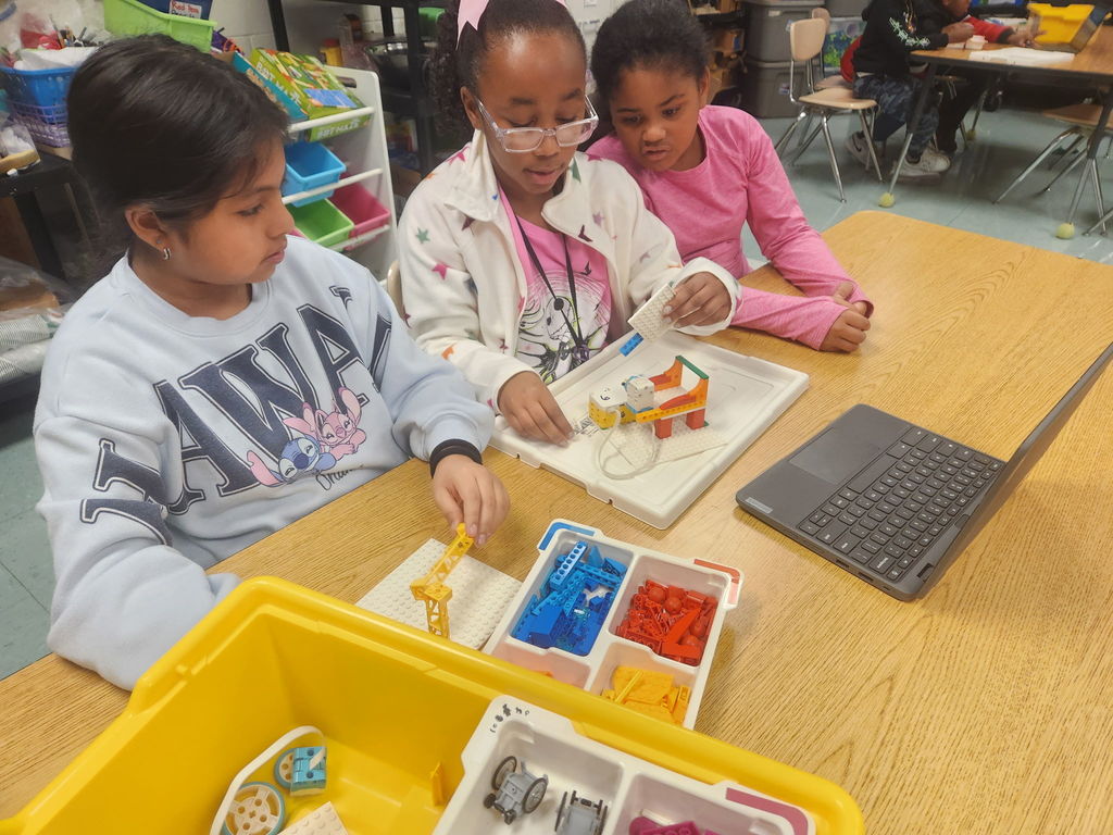 students building with legos