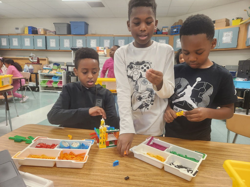 students building with legos