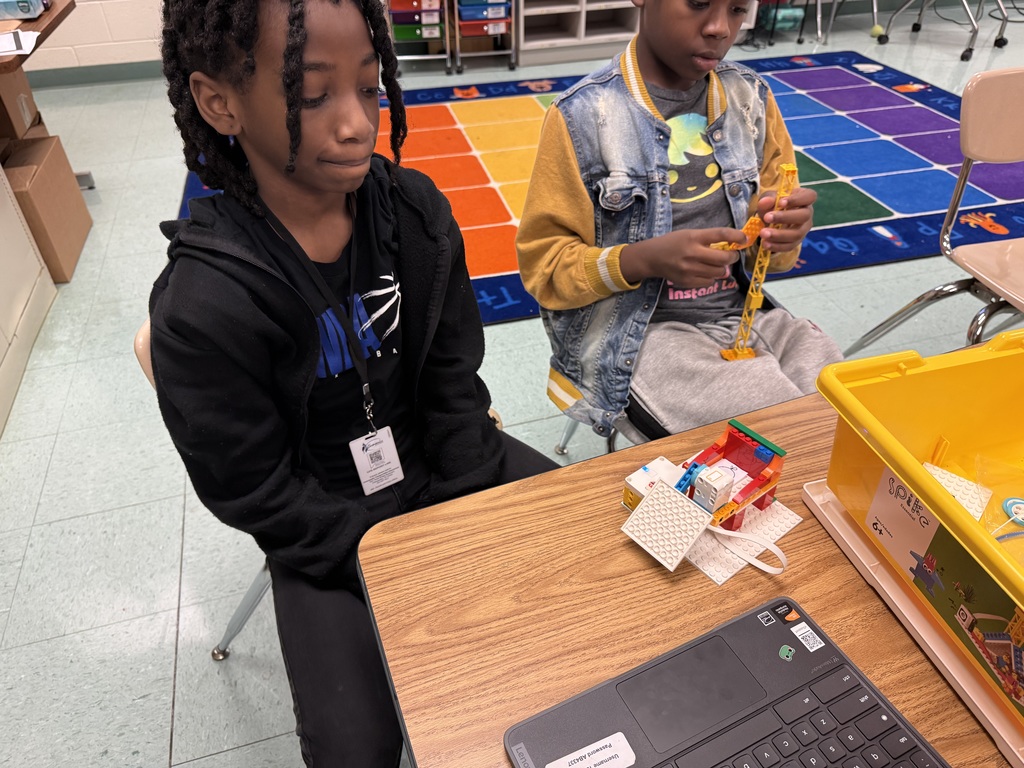 students building with legos