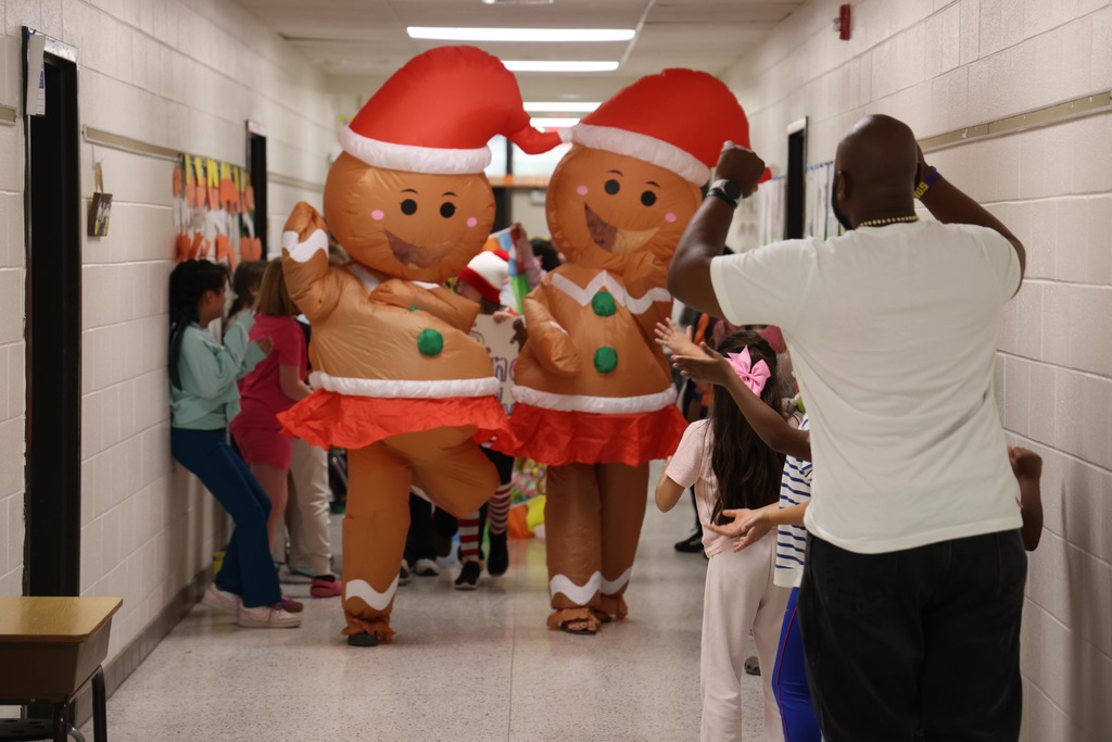 Blow up gingerbread men walking in the parade