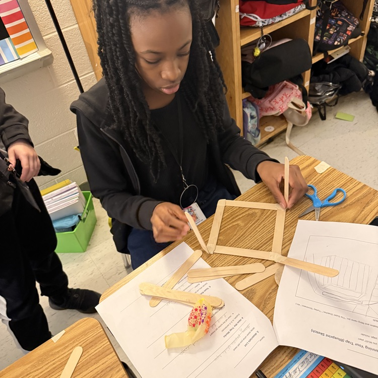 students working with popsicles for their traps