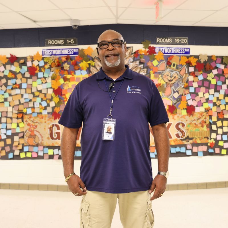 man with blue CPS shirt smiling at camera 