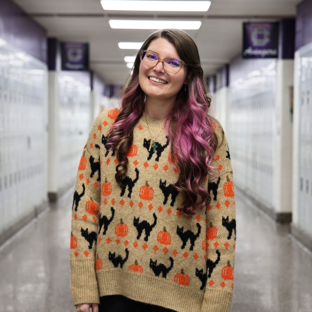young female teacher smiling for camera