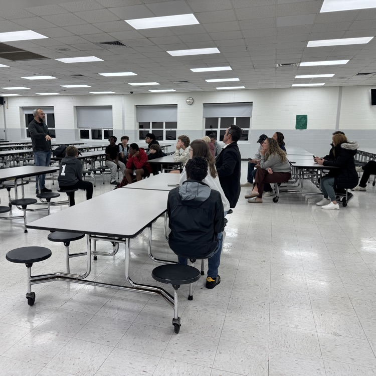 winter coaches and team members with family