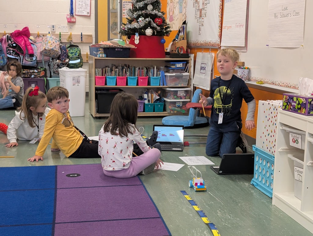 Kindergarten students building a Lego car to measure and then measure the distance it will travel at varying speeds.