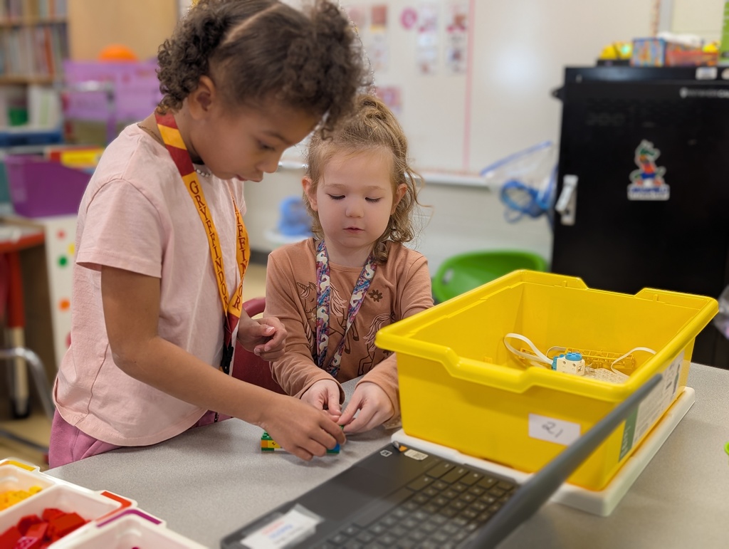Kindergarten students building a Lego car to measure and then measure the distance it will travel at varying speeds.