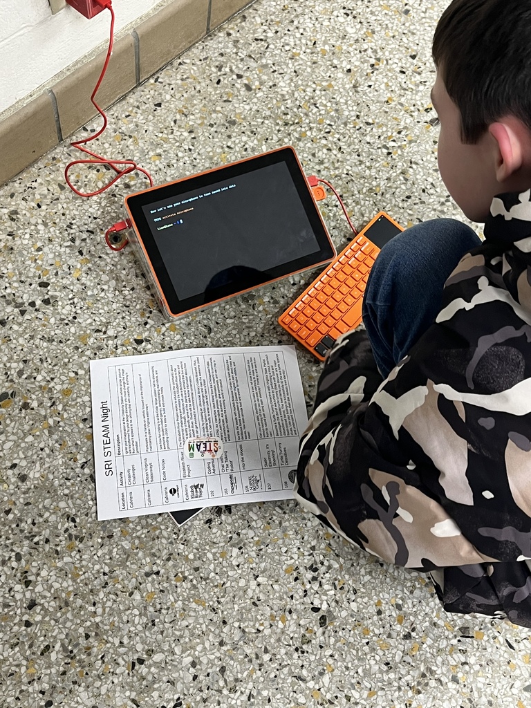 Student programing the computer he built