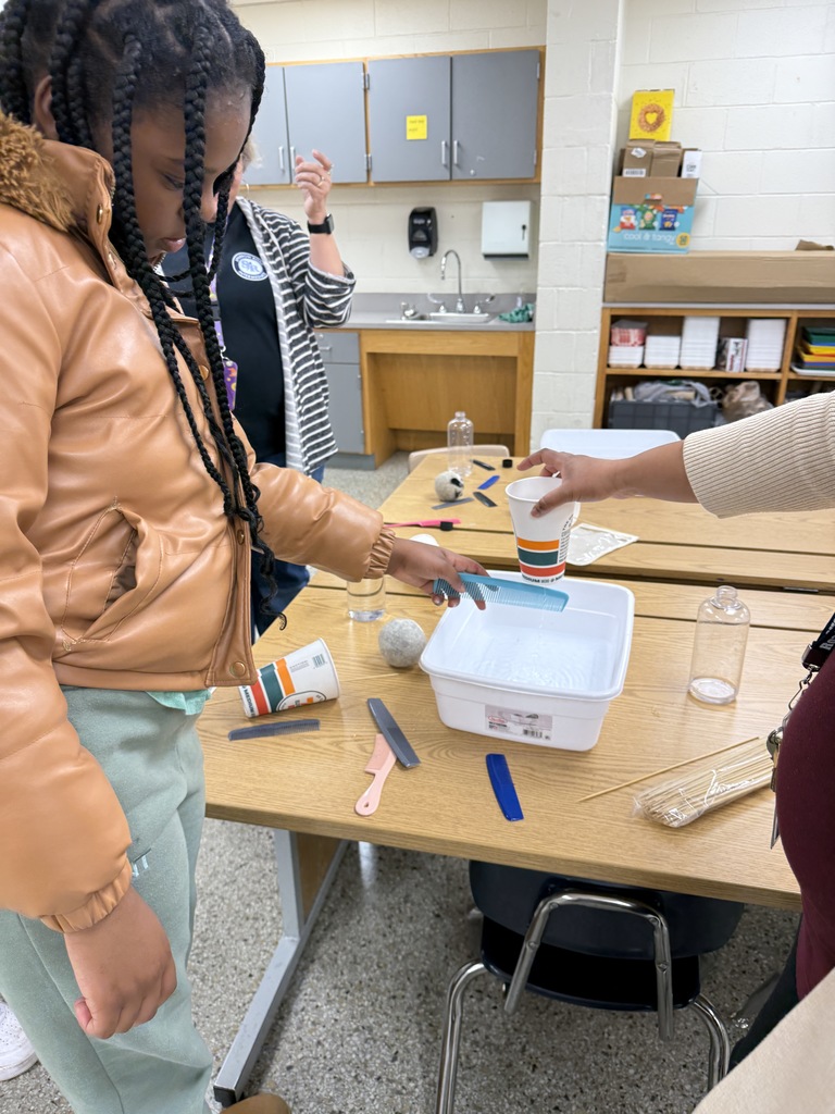 Using a comb to move water coming out of a cup