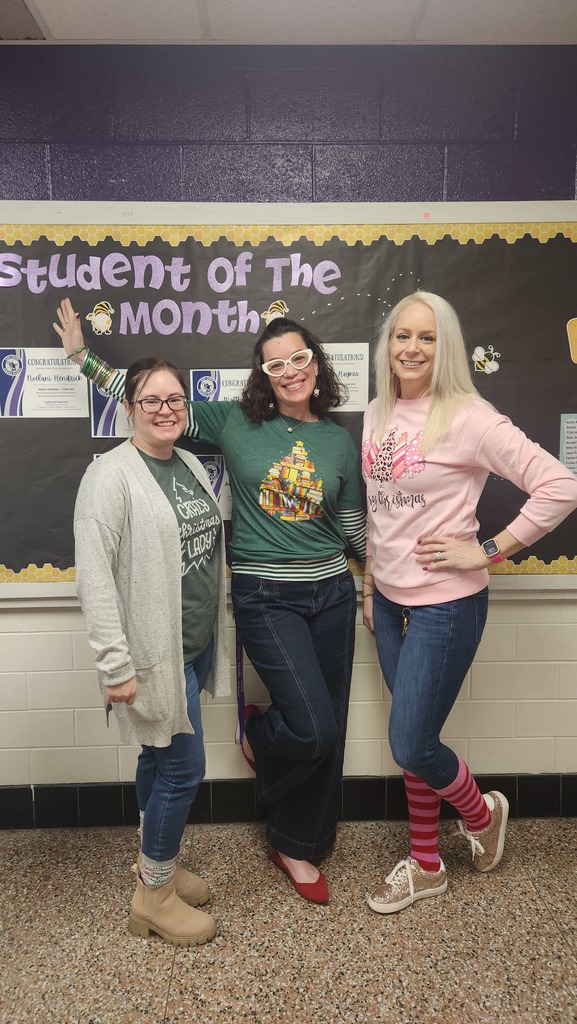 three teachers wearing a holiday shirts and socks