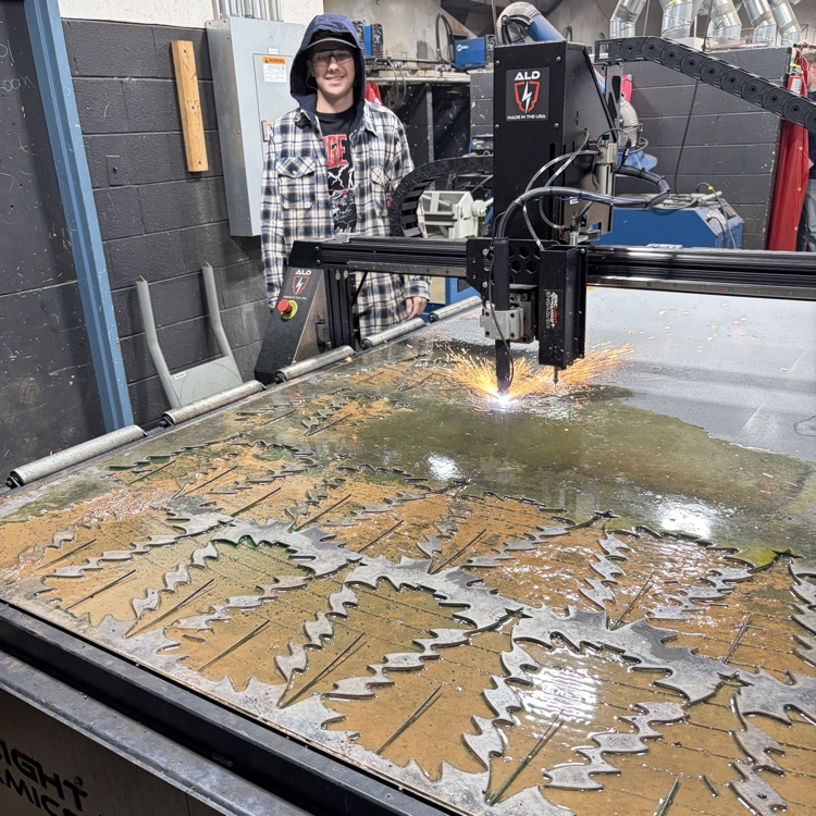 welding students fabricating trees
