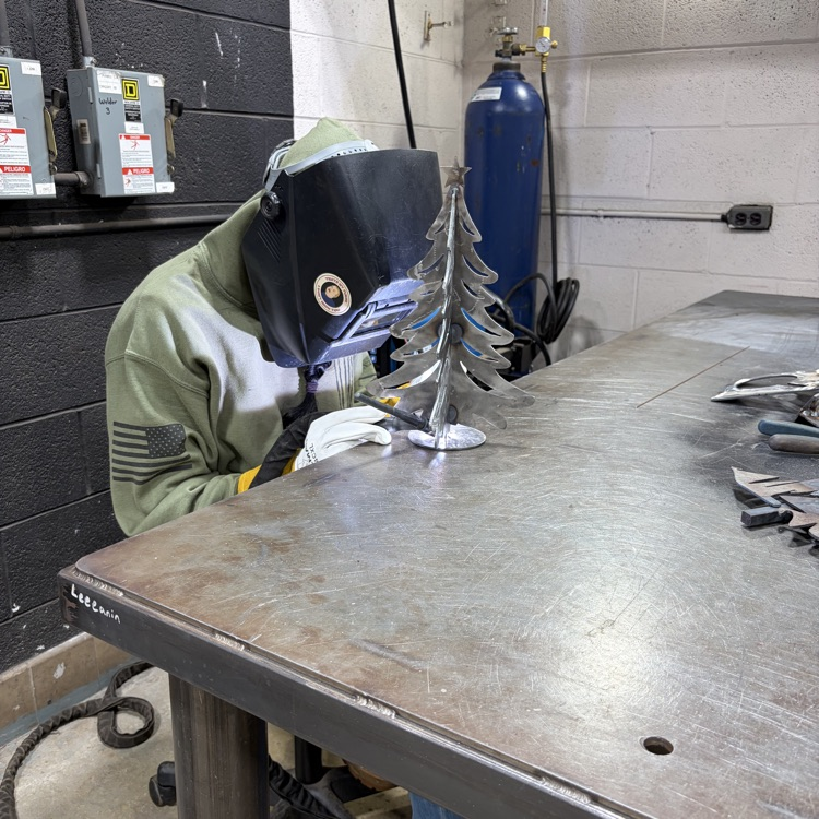 welding students fabricating trees