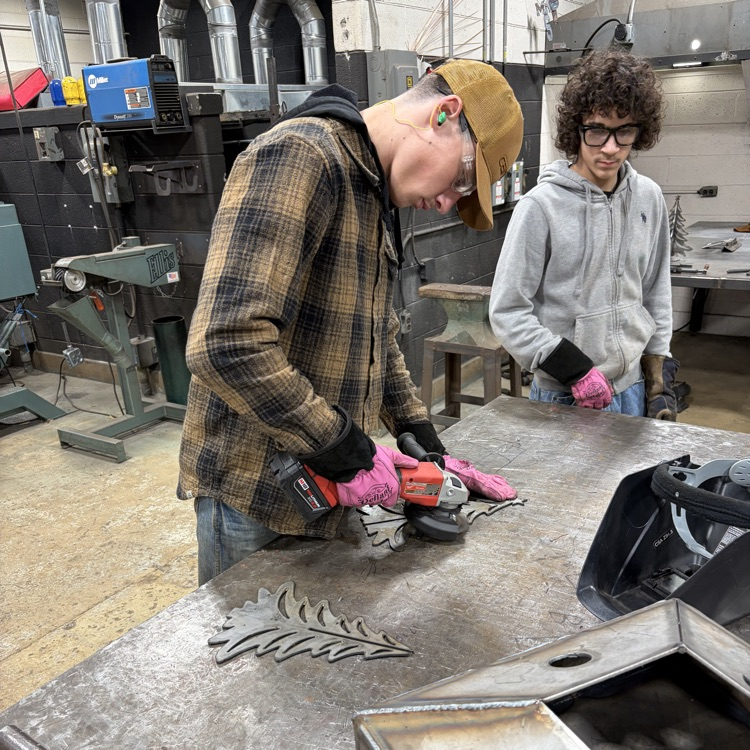 welding students fabricating trees