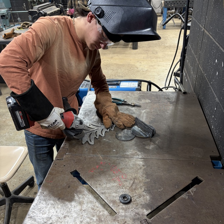 welding students fabricating trees