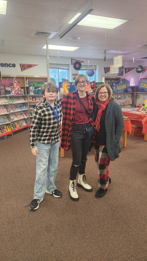 Two students and a teacher wearing flannel