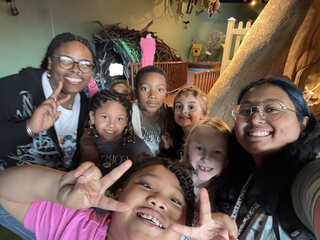 Ms. Roselle, Ms. Sawyer and second grade students pose for a selfie on their field trip to the Children's Museum in Portsmouth, VA