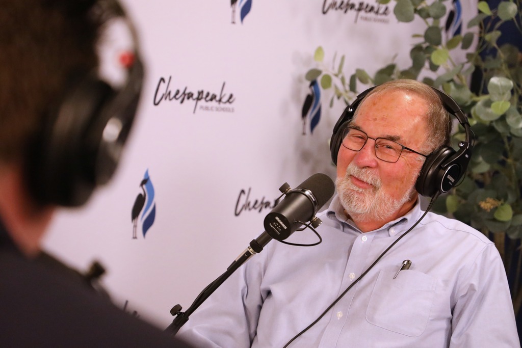 Bob Robinson, retired principal speaking.