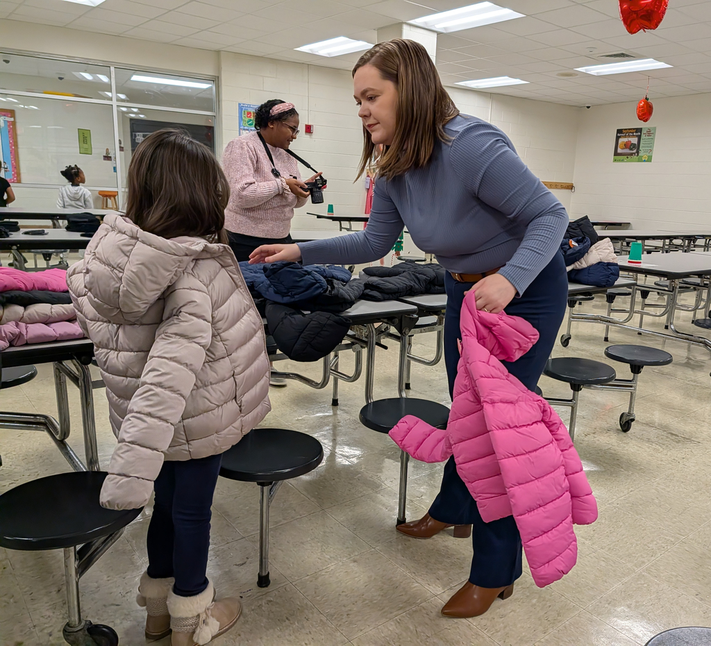 student trying on a new winter coat