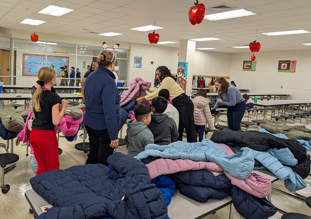 students waiting to try on new winter coats