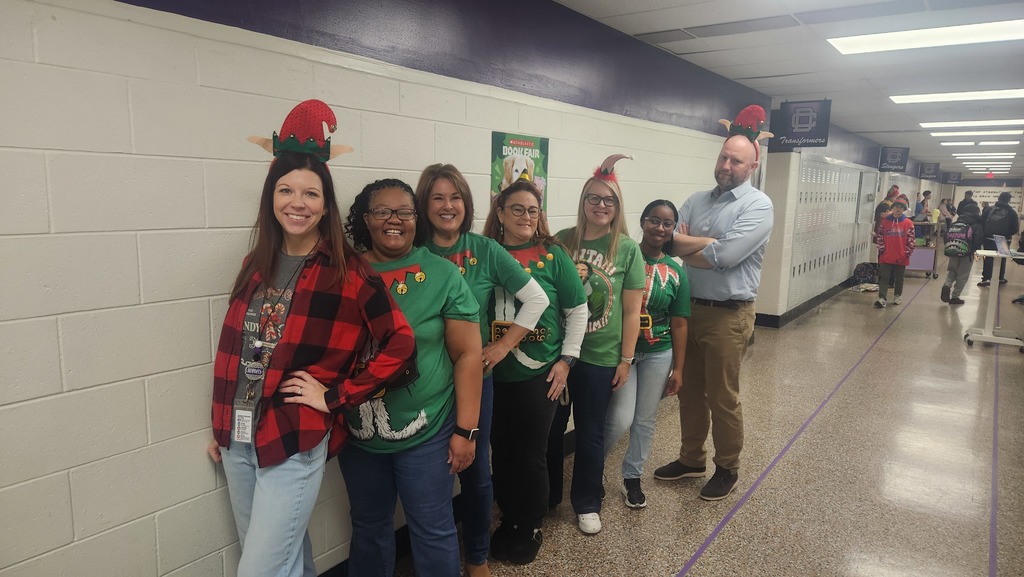 Six teachers dressed as elves