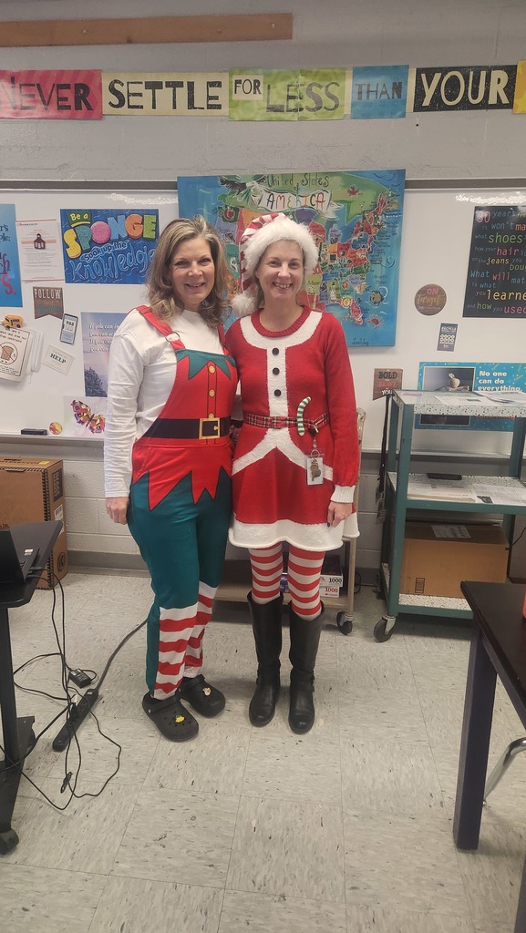 Two teachers dressed as elfs