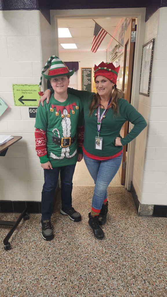 A teacher and and student dress as elves