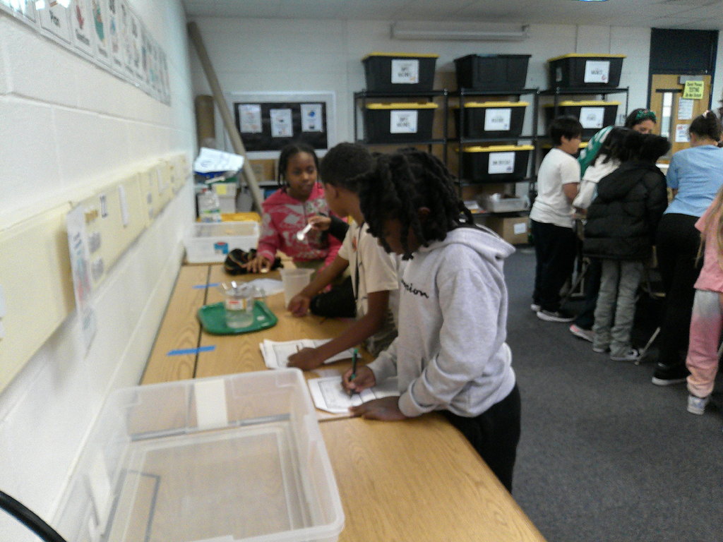 students investigate and observe affect of water temperature on dissolving