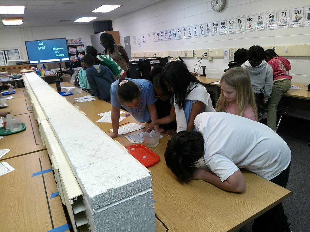 students investigate and observe affect of water temperature on dissolving