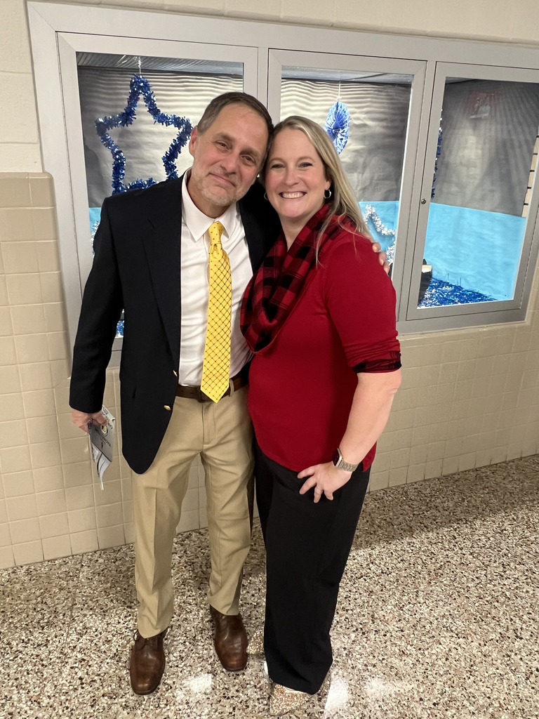 2 adults posing and smiling 