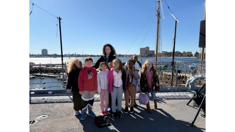smiling students  and their teachers