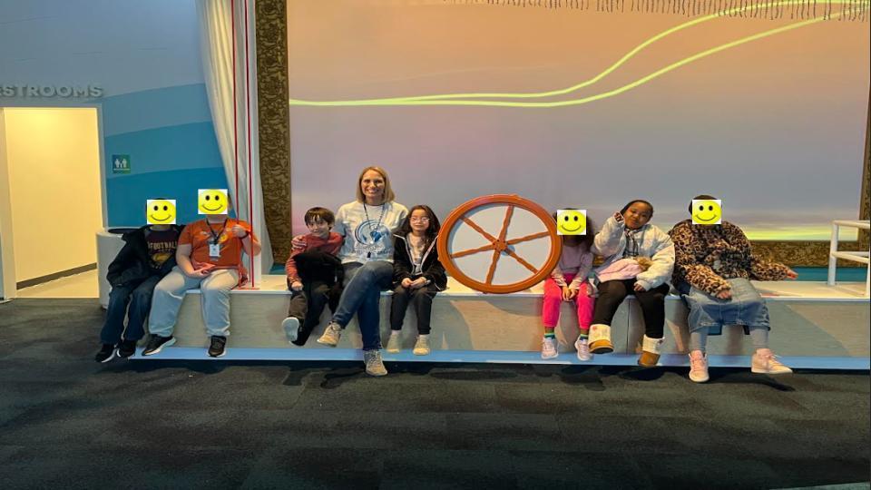 smiling students  and their teachers