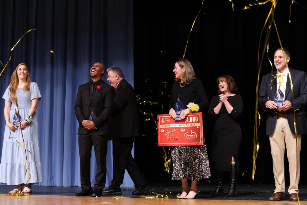 teachers of the year laughing at streamers