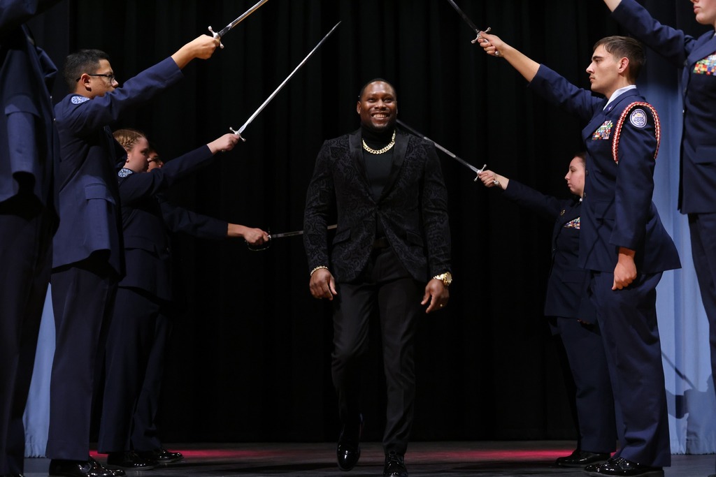 male toy walking through sword tunnel