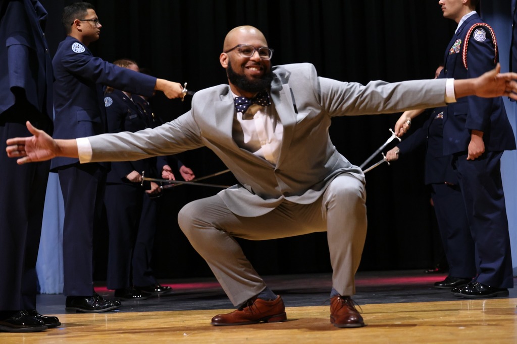 toy squatting and being silly with hands open