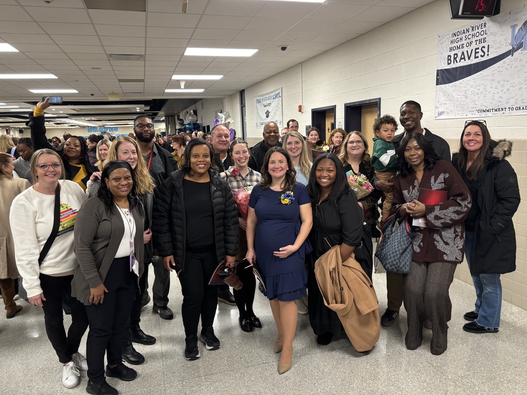 Staff and family with Mrs. Childs (center) celebrating Teacher of the Year.