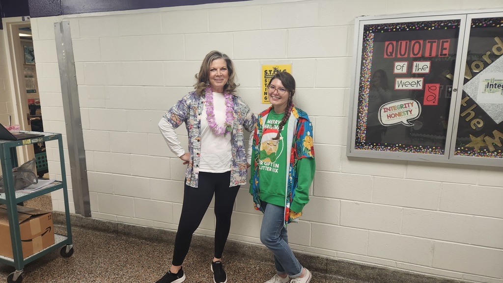 Two teachers wearing a Hawaiian shirts