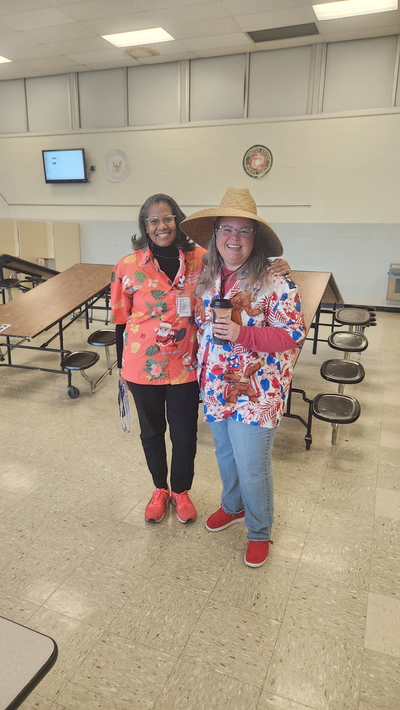 A teacher and the Principal wearing Hawaiian Shirts