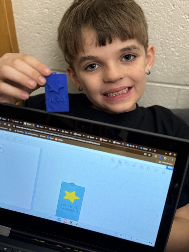 Tinkercad file and brag tag with student holding it