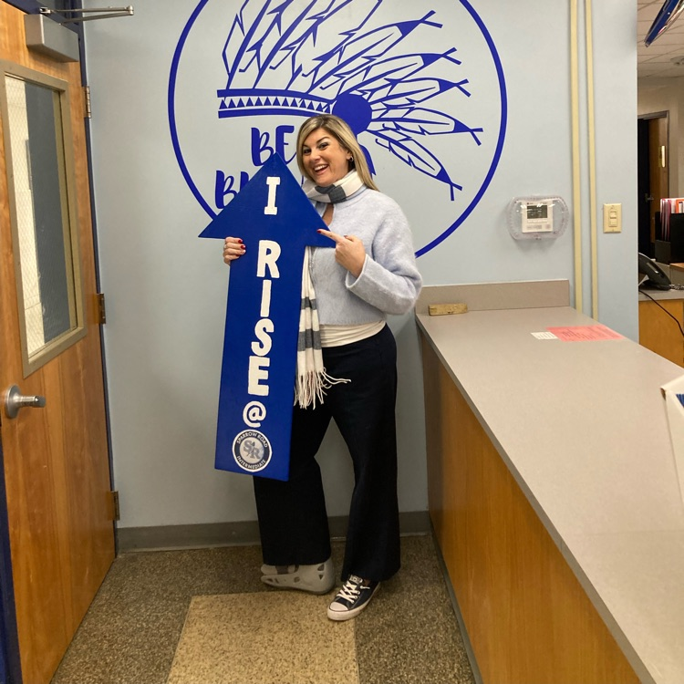 Mrs. Snow with I RISE sign 