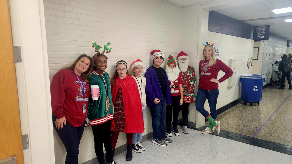 Several students and teachers dressed as Santas and reindeeers