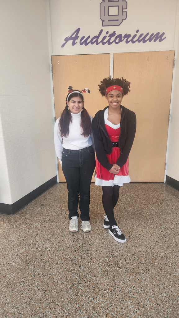 A snowman and a Mrs. Clause. Two students