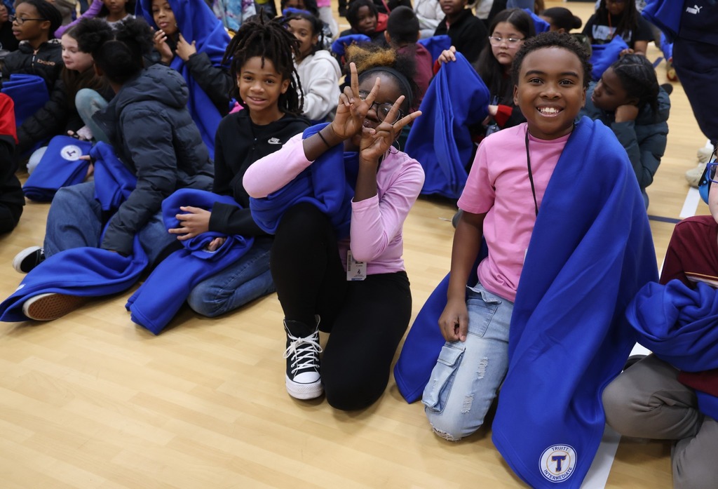 kids posing with blankets