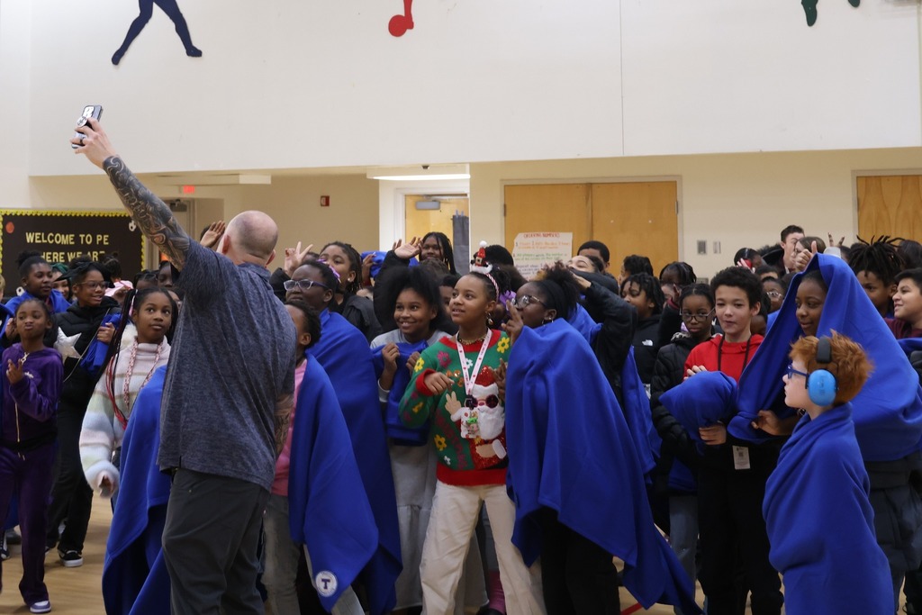 man taking selfie with fifth graders