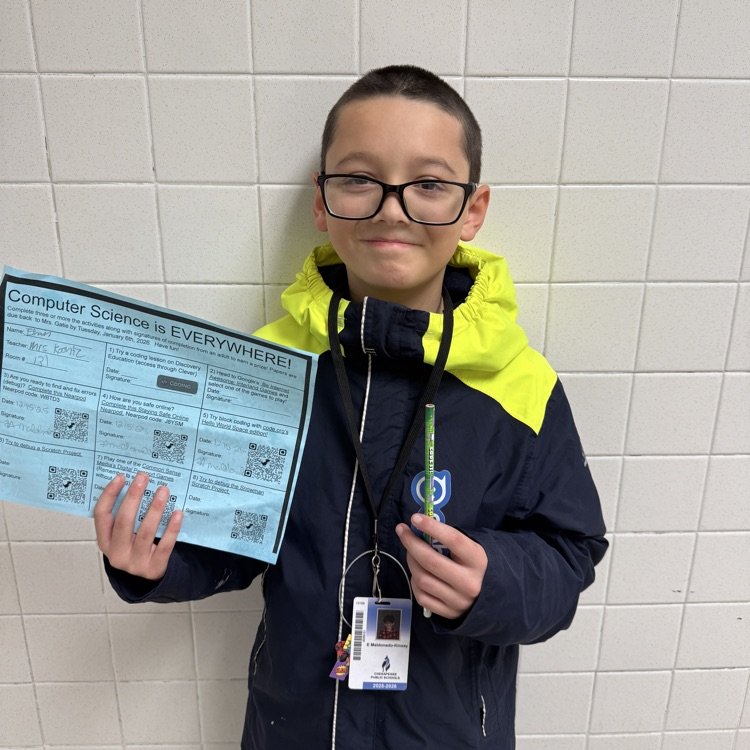 student with computer science challenge activity sheet and prize 