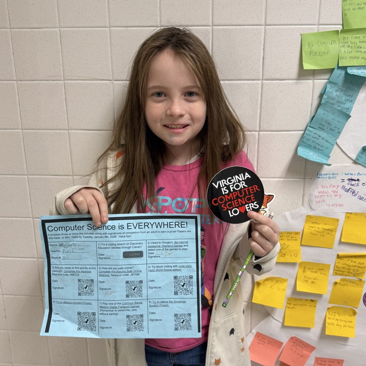 student with computer science challenge activity sheet and prize 