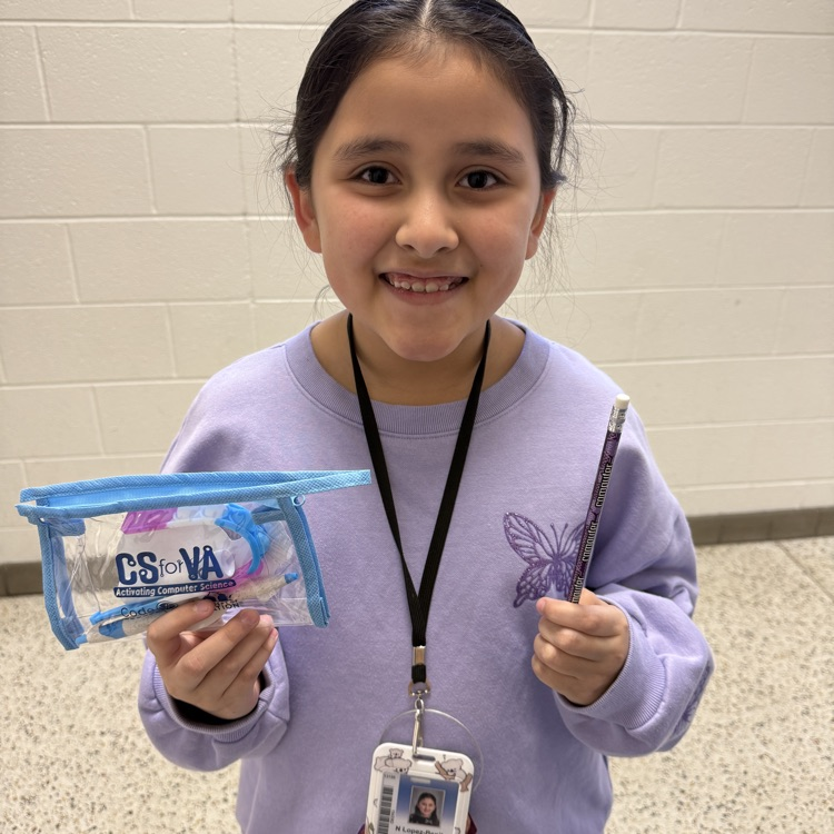 student with computer science challenge activity sheet and prize 