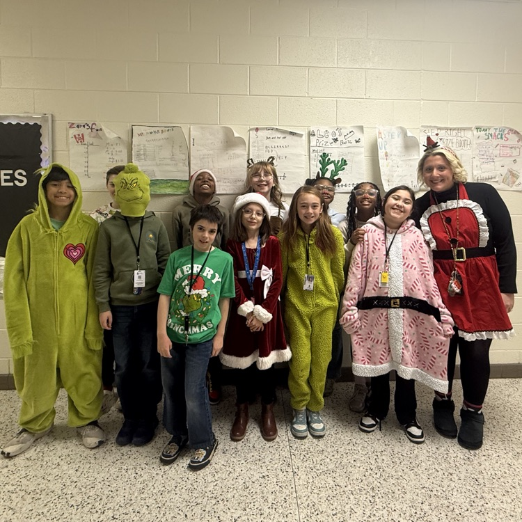students and teacher dressed for favorite holiday character 