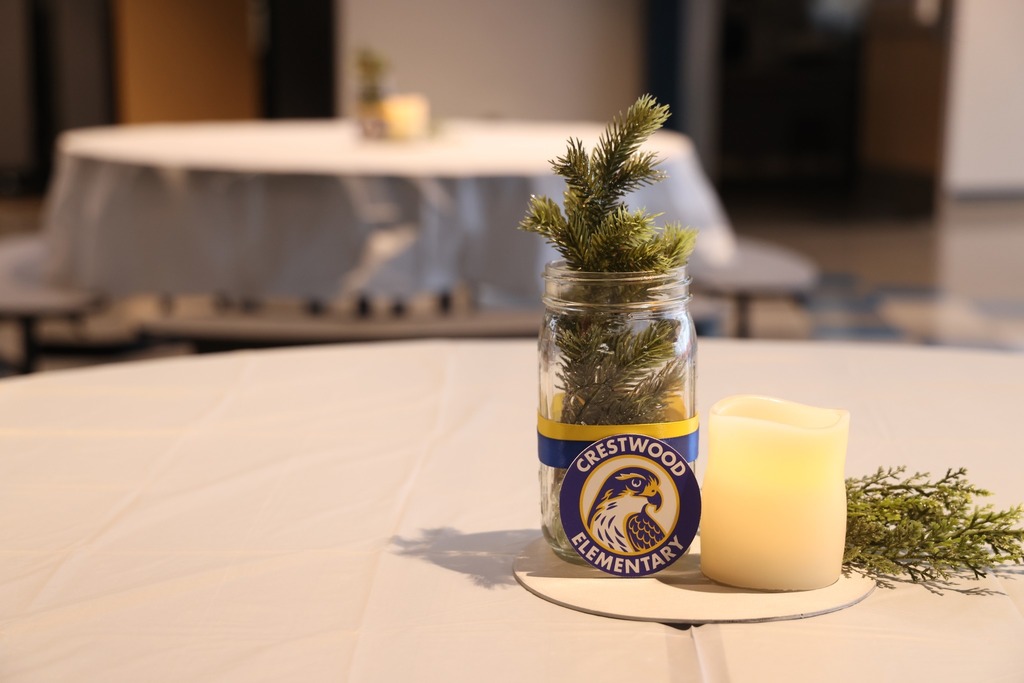 CWE table set up with candle and pin in jar